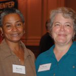 Symposium attendees enjoy panels and discussions.