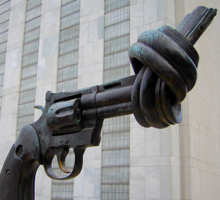Sculpture of a handgun with the barrel tied in a knot