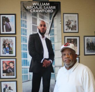 Stanley Crawford with a photo of his son, William Aboaje Samir Crawford. William was shot and killed on September 8, 2018. Mr. Crawford, who founded the Black Male Community Council of Philadelphia after the murder of his son, is a plaintiff in our lawsuit taking on state firearm preemption laws that block Philadelphia from passing many local gun safety measures.